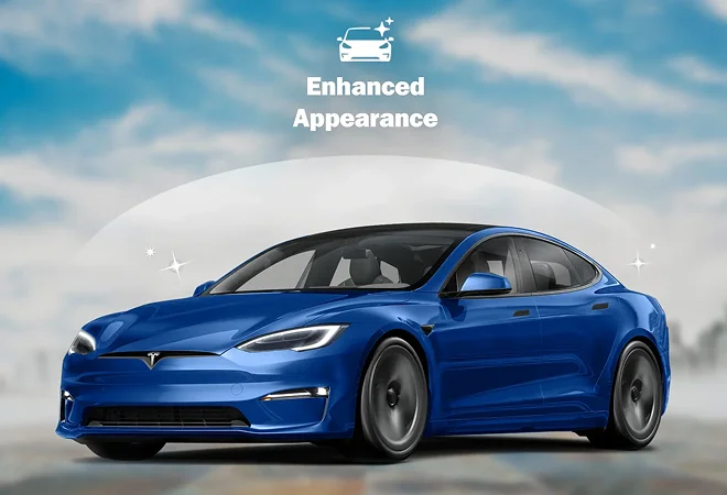 Shiny blue Tesla sedan with sparkle effects, shown against a cloudy blue sky background with overlaid text “Enhanced Appearance.”